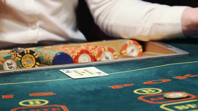 playing poker. dealer deals the cards and the game begins.