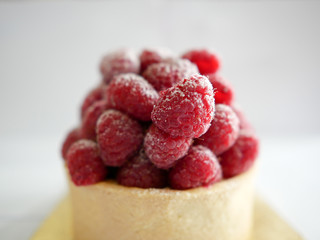Close up raspberry tart with white background