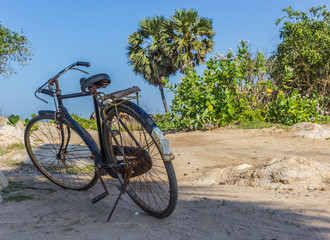 Fototapeta na wymiar Beautiful beach lagoon bicycle rocks boy