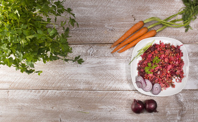Russian beetroot salad vinaigrette on gray wood background