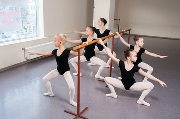 Children are taught ballet positions in choreography.
