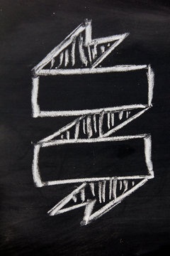 Blank ribbon draw by white chalk on black board background