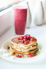 pancakes with pomegranate and a smoothie