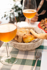 bread basket and drinks in a restaurant