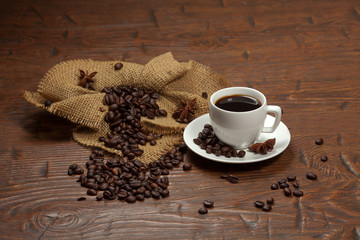 White cup of coffee with beans