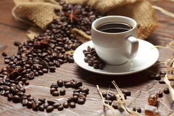 White cup of coffee with beans
