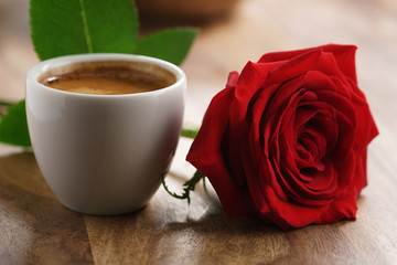 fresh espresso with red rose flower, romantic morning photo
