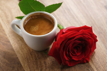 Obraz na płótnie Canvas fresh espresso with red rose flower, romantic morning photo