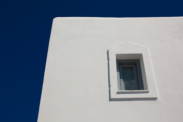 Window detail on a white Greek villa