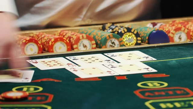 playing poker. dealer deals the cards and the game begins.