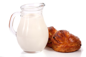 jug of milk with a loaf of bread isolated on white background