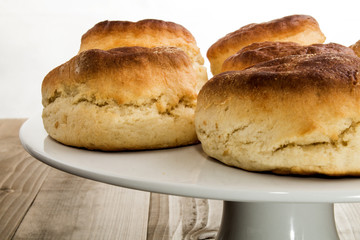 british plain scone on a white china cake stand