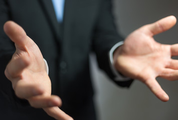 Businessman showing his empty hand