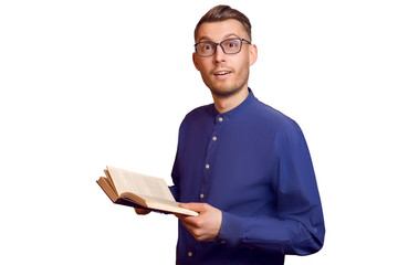 Surprised young botanist in a point and with a book in his hands