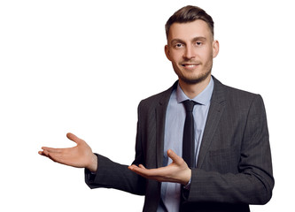 Young handsome businessman showing something
