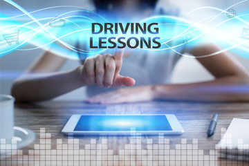 Woman using tablet pc, pressing on virtual screen and selecting driving lessons.