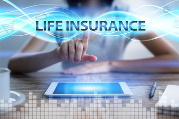 Woman using tablet pc, pressing on virtual screen and selecting life insurance.