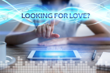 Woman using tablet pc, pressing on virtual screen and selecting looking for love.