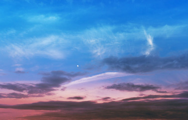 Sunset with sun rays, sky with clouds and sun.