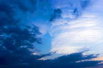 Sunset with sun rays, sky with clouds and sun.