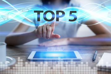 Woman using tablet pc, pressing on virtual screen and selecting top 5.