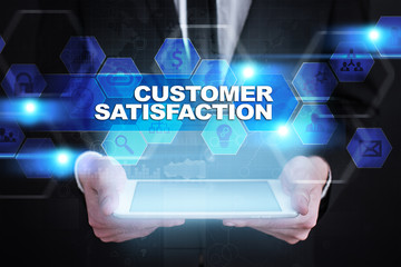 Businessman holding tablet PC with customer satisfaction concept.