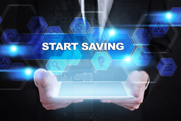 Businessman holding tablet PC with start saving concept.