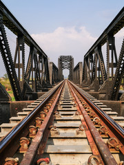Steel structure of railway bridge, railway rail with vanishing point, amazing perspective