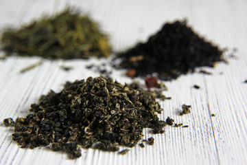assortment of dry tea on wooden background