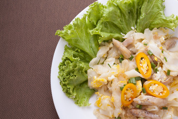 Fried noodle with chicken with space for wording or cooking tropic.