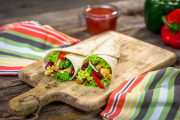 Meat and vegetables wrapped in a tortilla