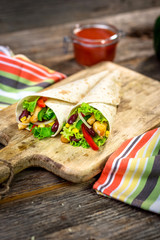 Meat and vegetables wrapped in a tortilla