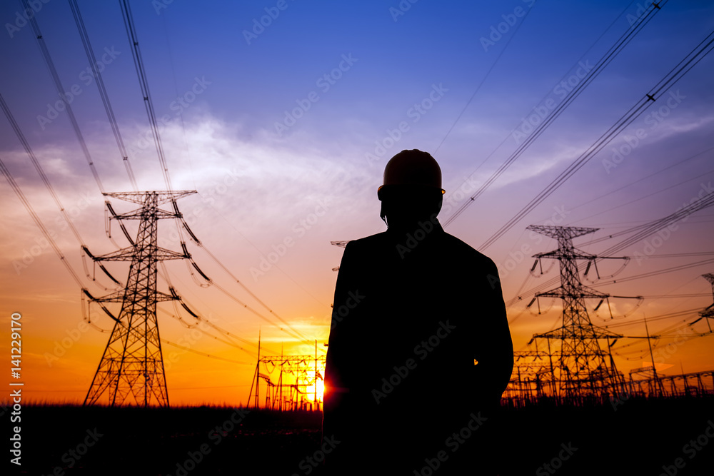 Wall mural electricity workers and pylon silhouette