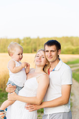 Portrait of beautiful young future parents outdoors