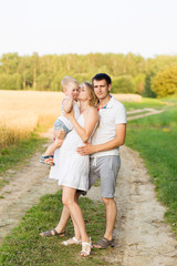 Fototapeta premium Portrait of beautiful young future parents outdoors