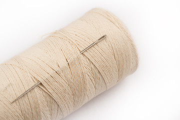 sewing needle on thread