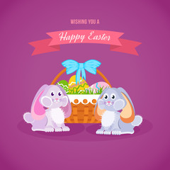 Two lovely festive rabbits, near the basket with Easter eggs.