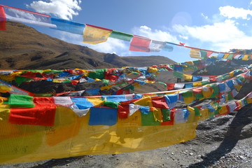 colourful prayer flags  over mountains
