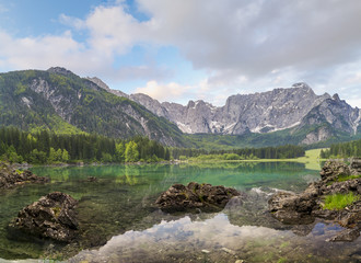 Naklejka na ściany i meble Mountain lake in the morning, Laghi di Fusine in the Julian Alps, Italy