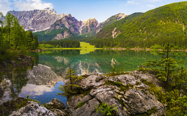Fototapeta na wymiar Mountain lake in the morning, Laghi di Fusine in the Julian Alps, Italy