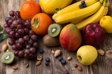 Assorted fruits on wooden backgound