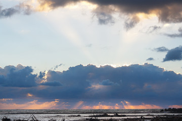 Amazing sea sunset on a background the cloudy sky after the storm