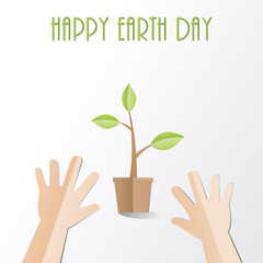 Hands try to  holding young plant with Happy Earth Day text, paper cut style  Ecology and Earth day concept