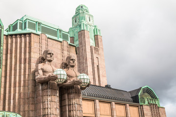 Fototapeta na wymiar Statue in front of Helsinki Central station
