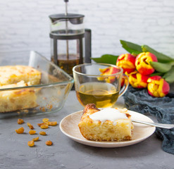 A piece of casserole with cottage cheese