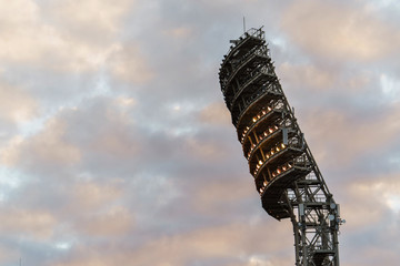 the floodlights at the stadium against the sky with clouds