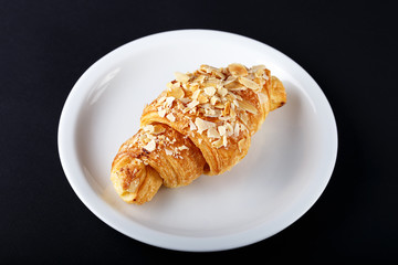 breakfast croissant on a black background