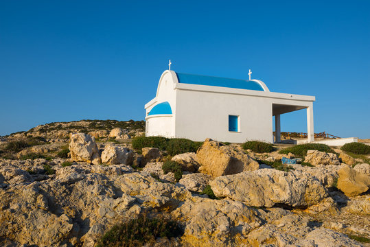 Church on the rocky shore of the cape Greco
