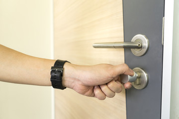 man locking Door Handles stainless steel on door wood