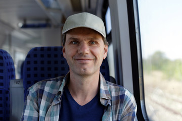 Happy man in a train